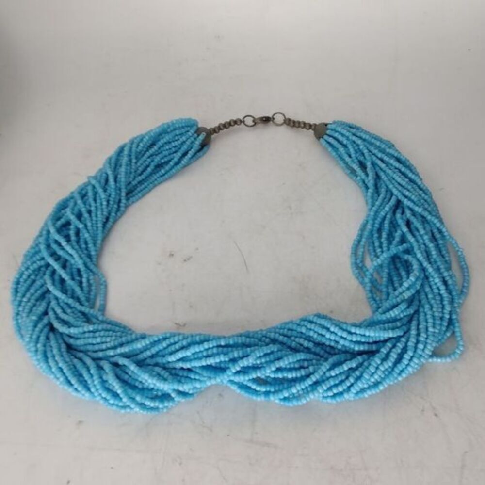 Necklace of many strands of turquoise seed beads